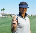 Woman Golfer holding golf club, why do women quit playing golf