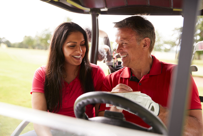 couple in golf cart